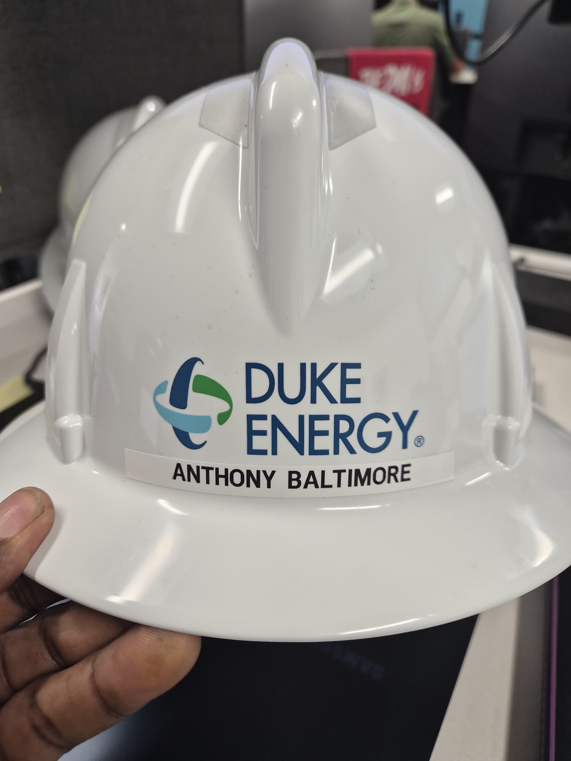 Duke Energy contractor hard hat issued to Anthony Baltimore of 25 Hour Drone and Videography